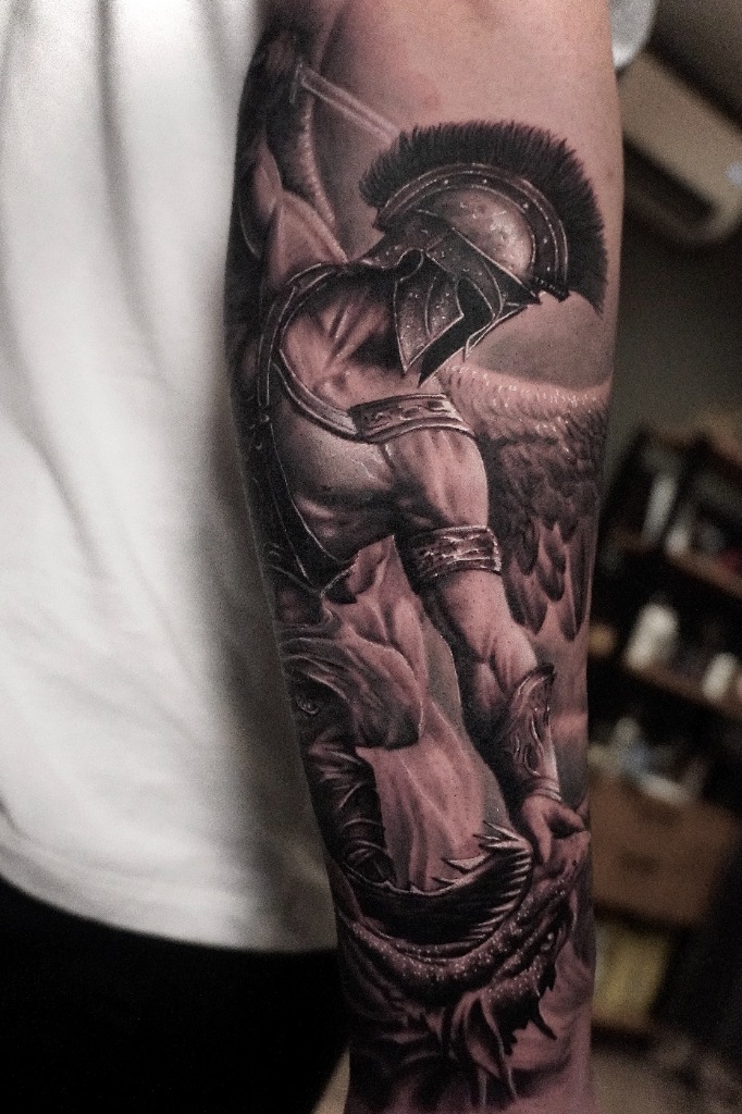 Winged archangel warrior slaying a beast with a sword in epic black and grey realism